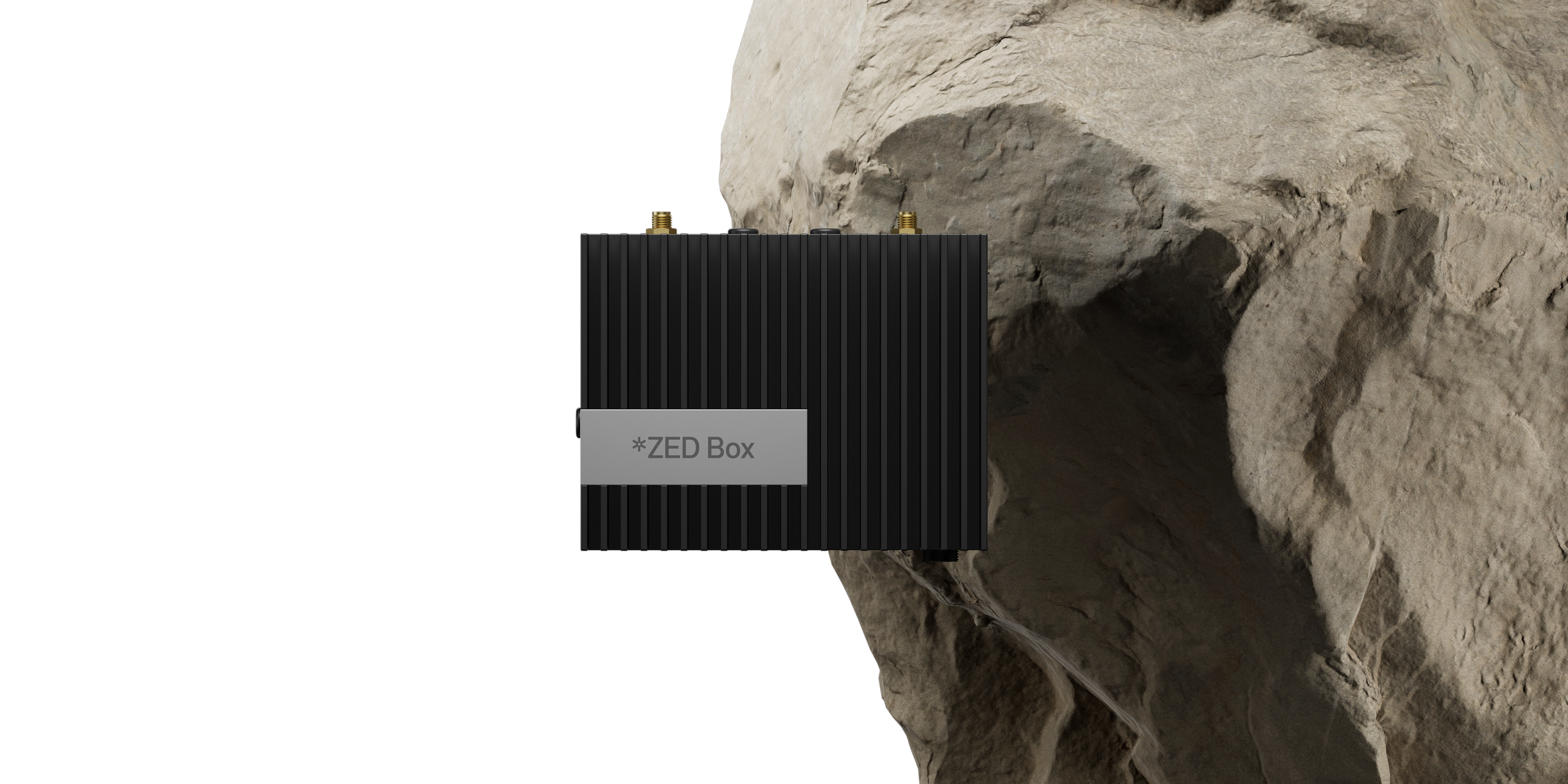 ZED Box Orin NX with a big rock behind it